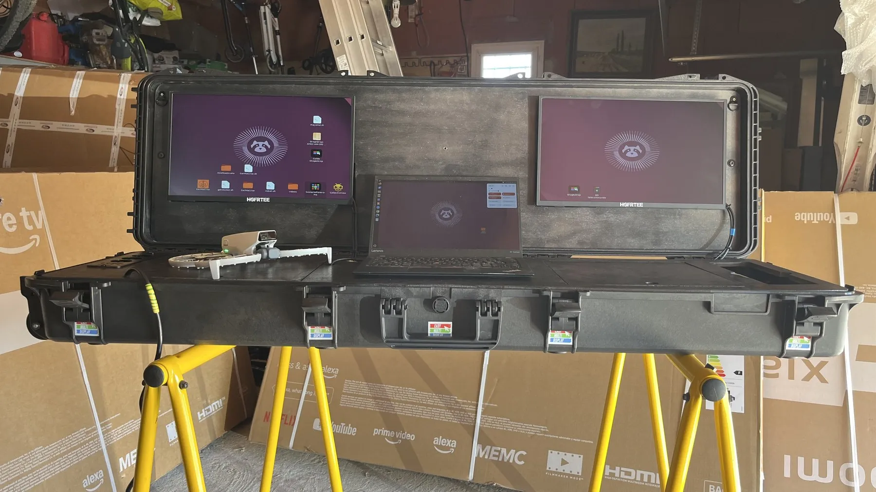 EMD command case open on trestles: two screens in the lid and the laptop in the centre